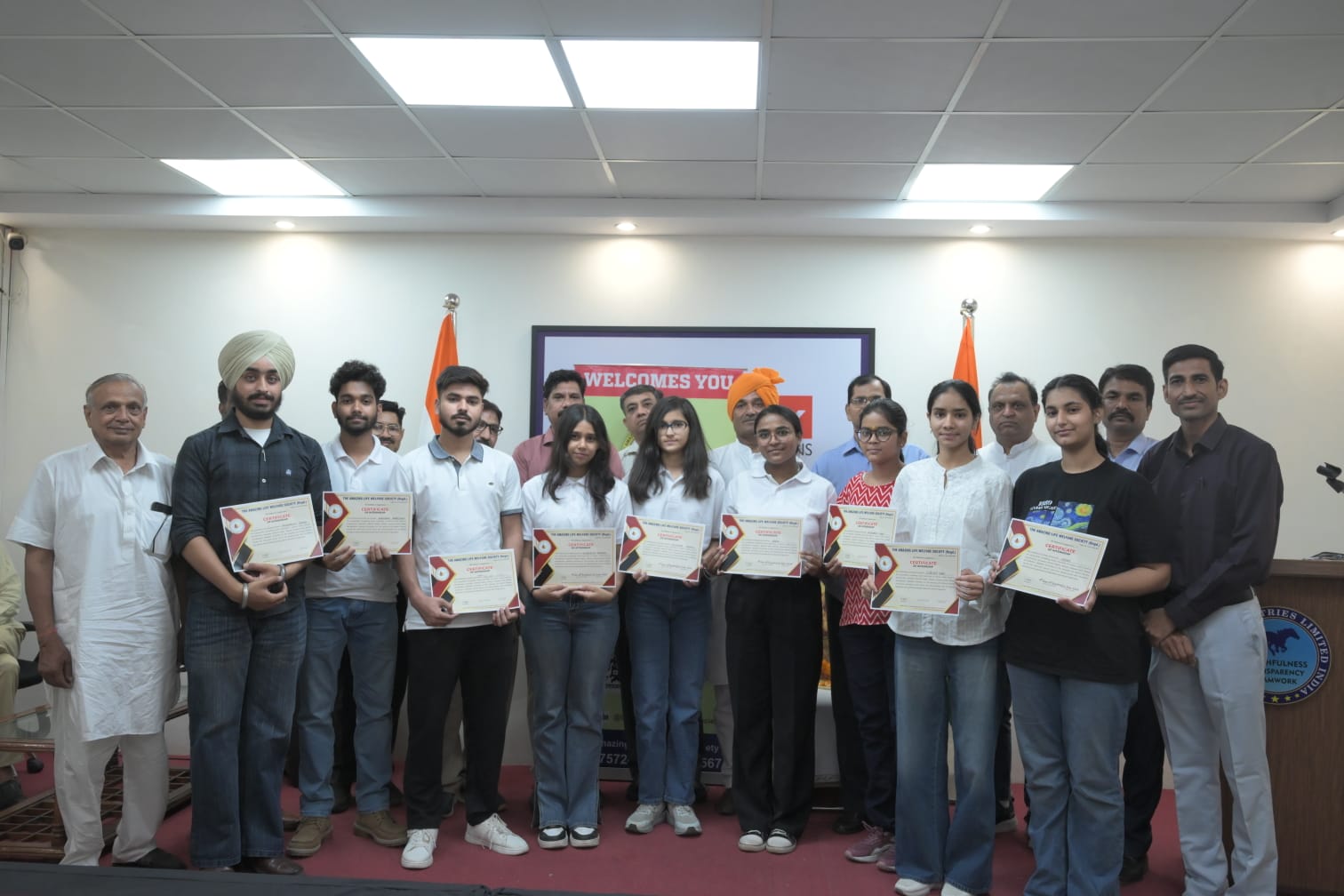 Interns receiving their certificates at a ceremony