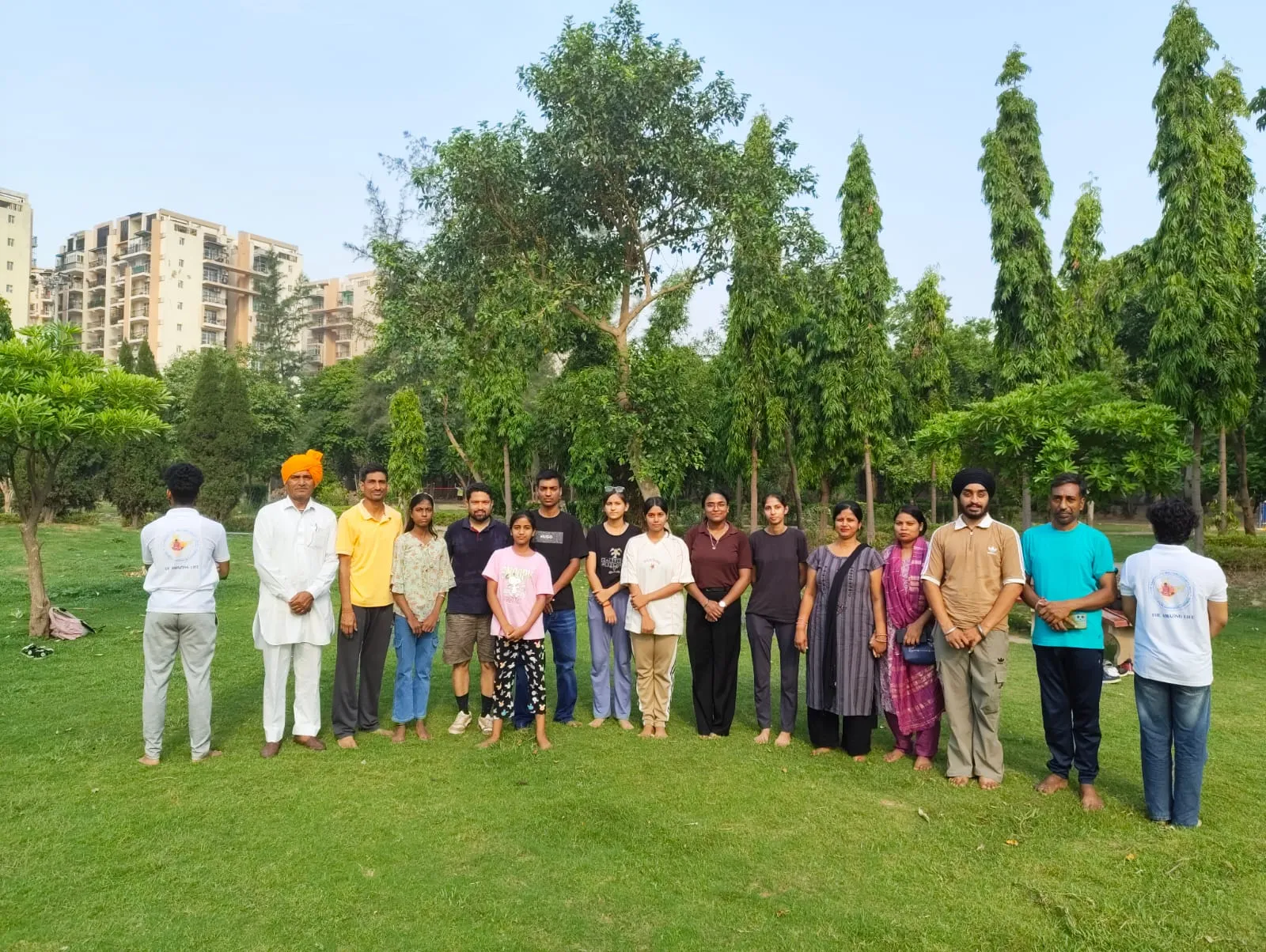 The student intern cohort gathered together in a park